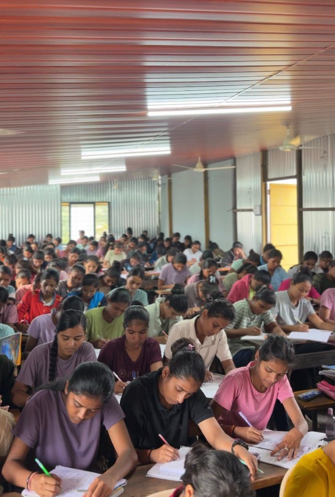 Students attending a lecture classroom session Phoenix Academy Satara